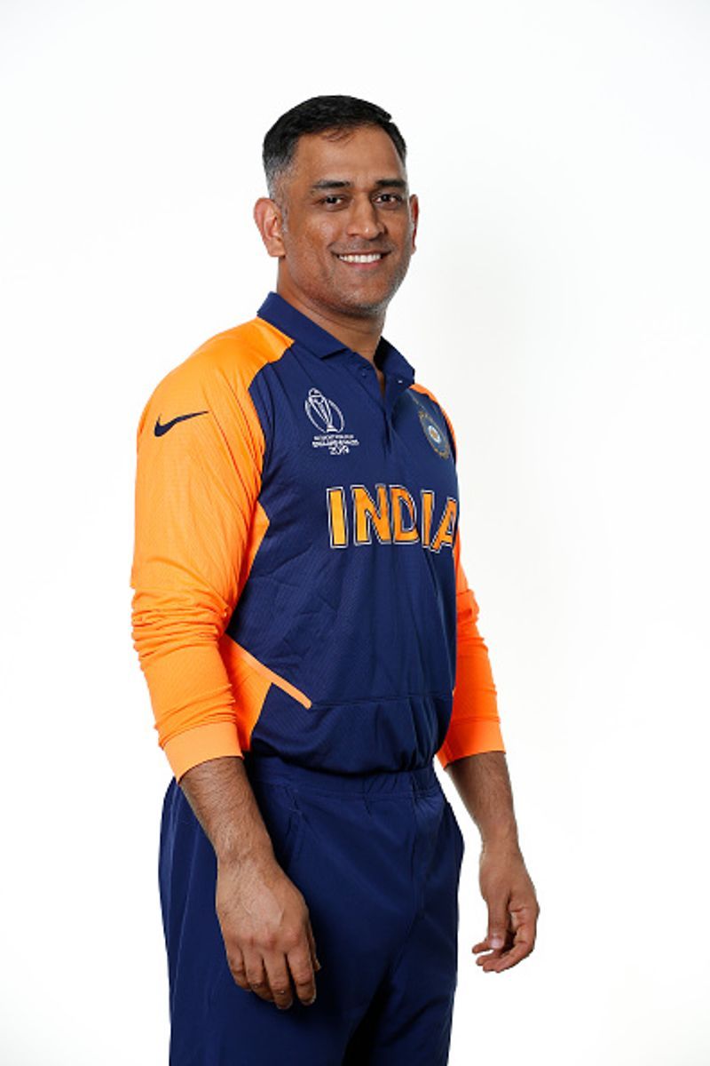 ms dhoni in orange jersey