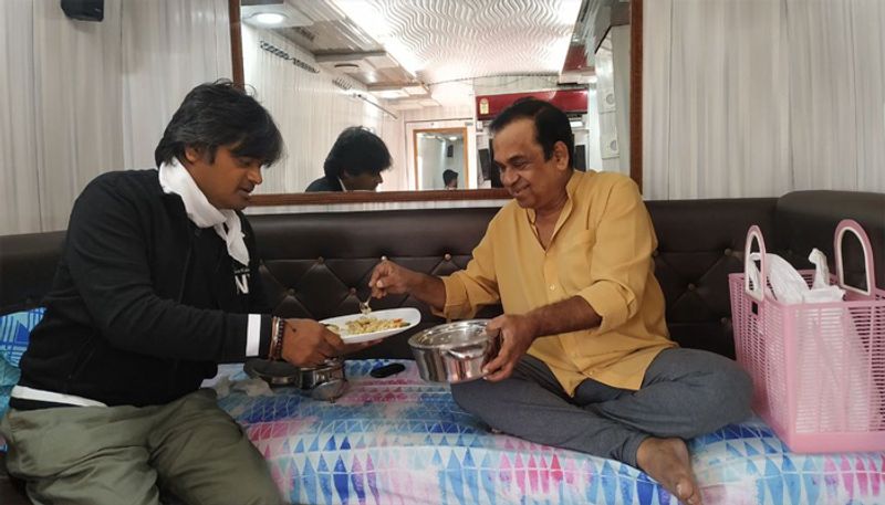Star comedian Brahmanandam share lunch box with Harish Shankar