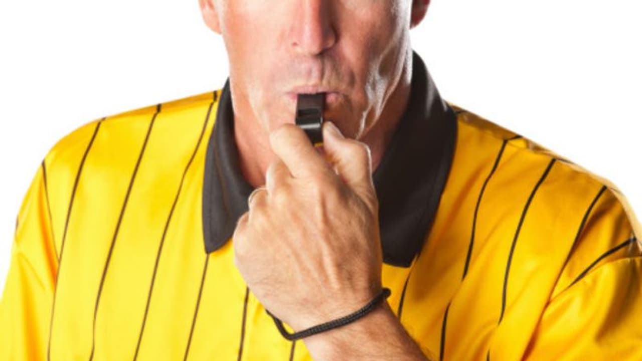Referee blowing whistle Referee blowing whistle