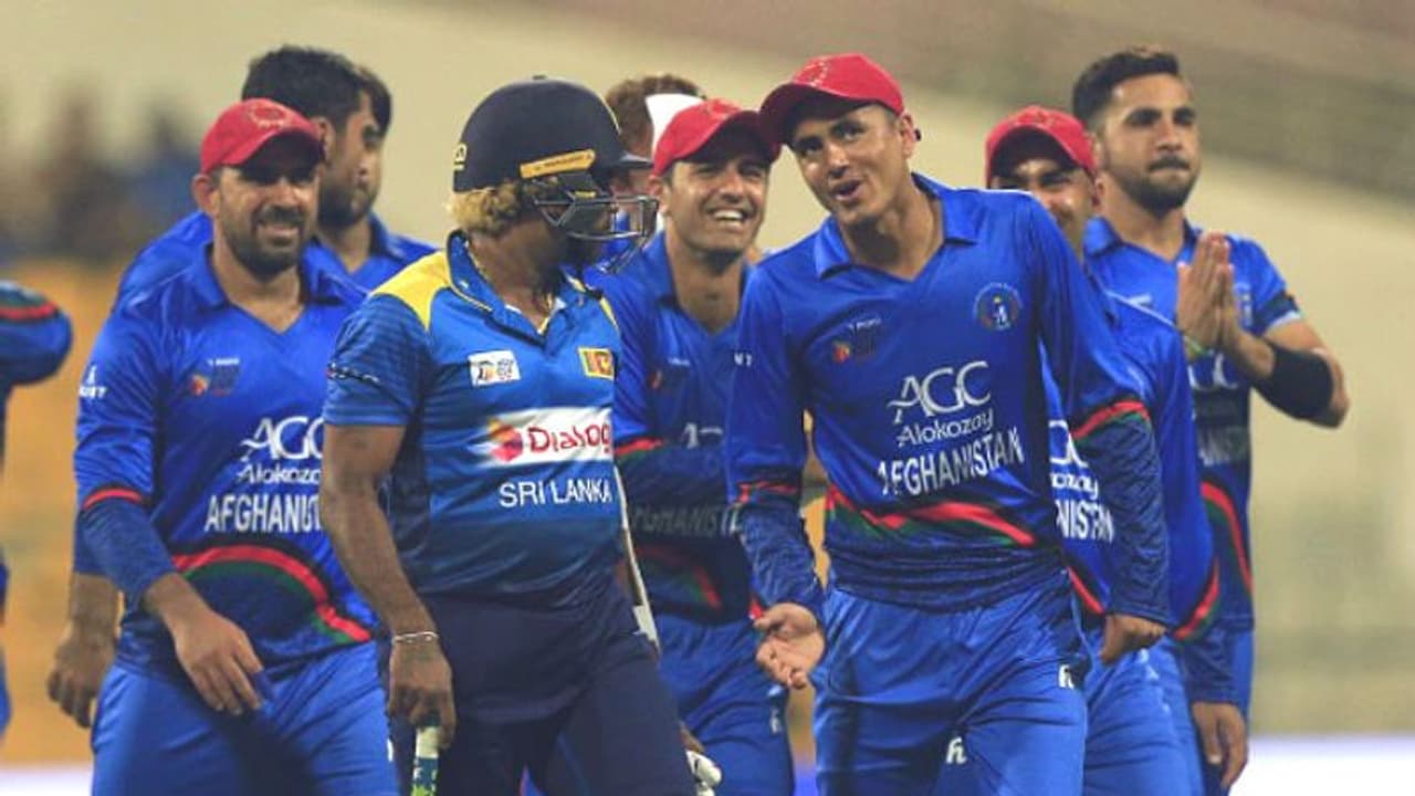 Afghanistan cricketer Mujeeb Ur Rahman and Sri Lankan cricketer Lasith Malinga