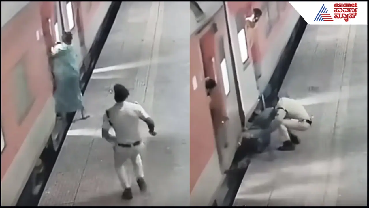 Railway security personnel saving a woman Railway security personnel saving a woman