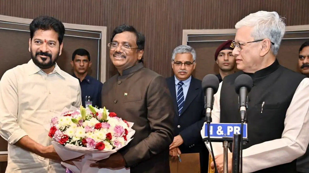 Revanth Reddy congratulates the newly sworn in Telangana cabinet minister, Vivek Venkata Swamy