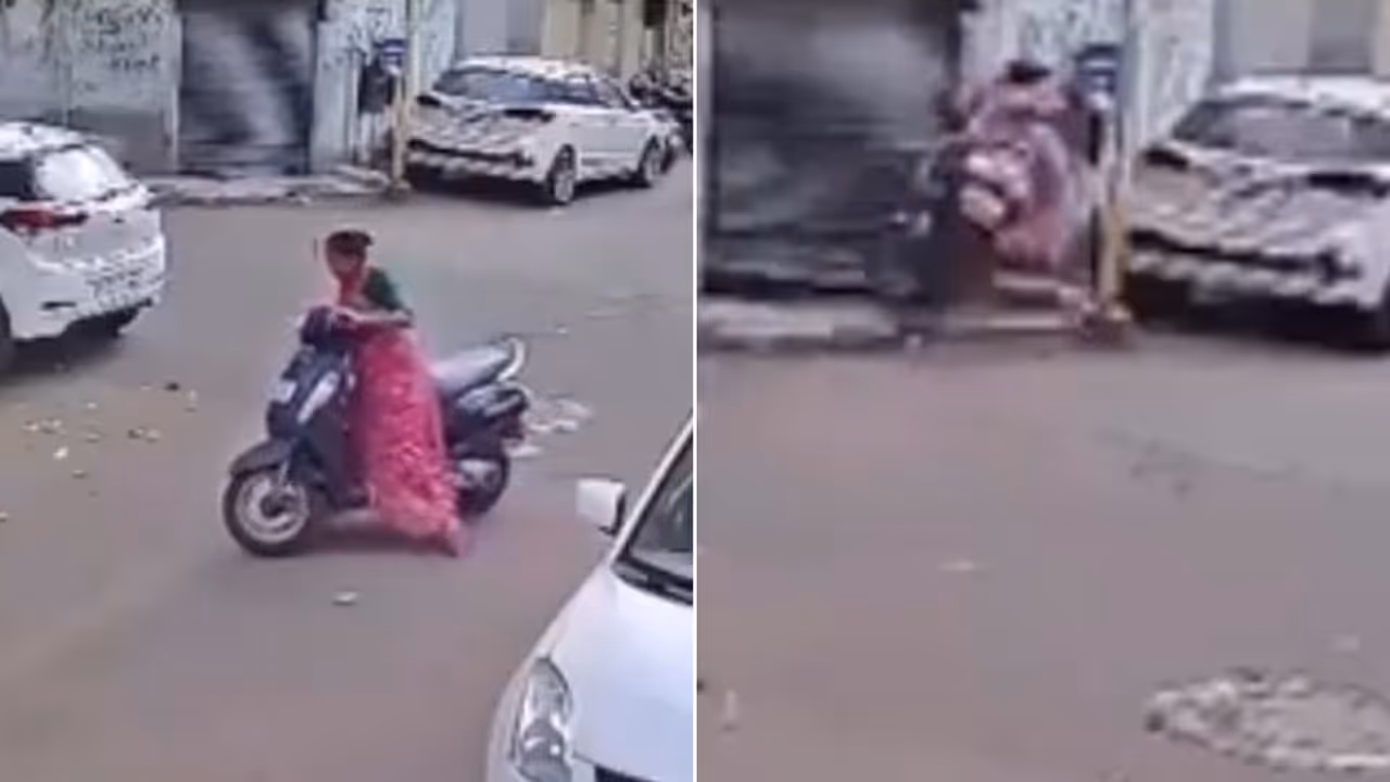 Watch: Woman Loses Control of Activa, Crashes Straight Into Shop Shutter in Rajkot; CCTV Video Goes Viral Watch: Woman Loses Control of Activa, Crashes Straight Into Shop Shutter in Rajkot; CCTV Video Goes Viral
