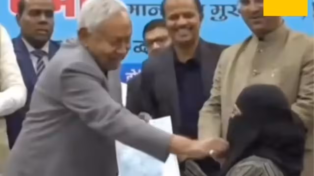 nitish kumar tries to remove doctors hijab on stage nitish kumar tries to remove doctors hijab on stage