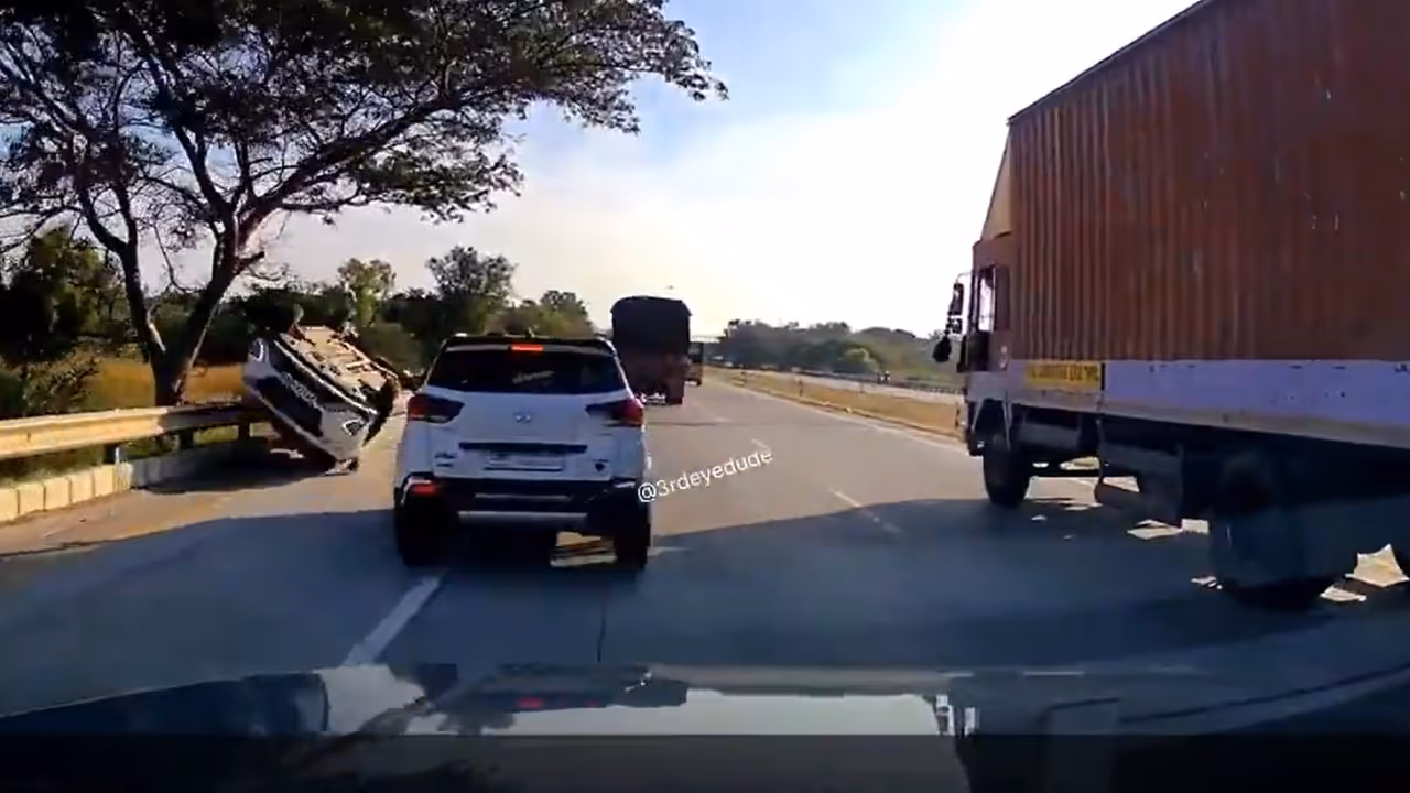 White car overturns while overtaking a truck on Bengaluru’s NICE Road White car overturns while overtaking a truck on Bengaluru’s NICE Road