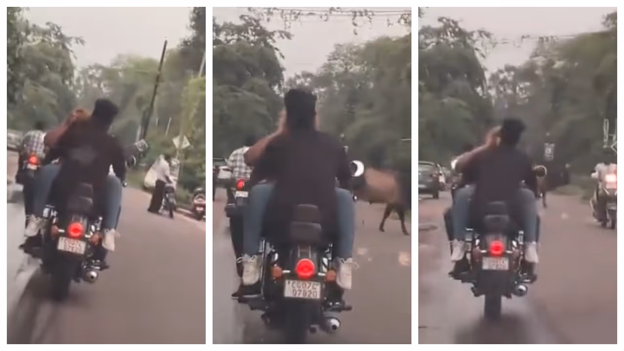 couple sitting face to face on a bike without helmets