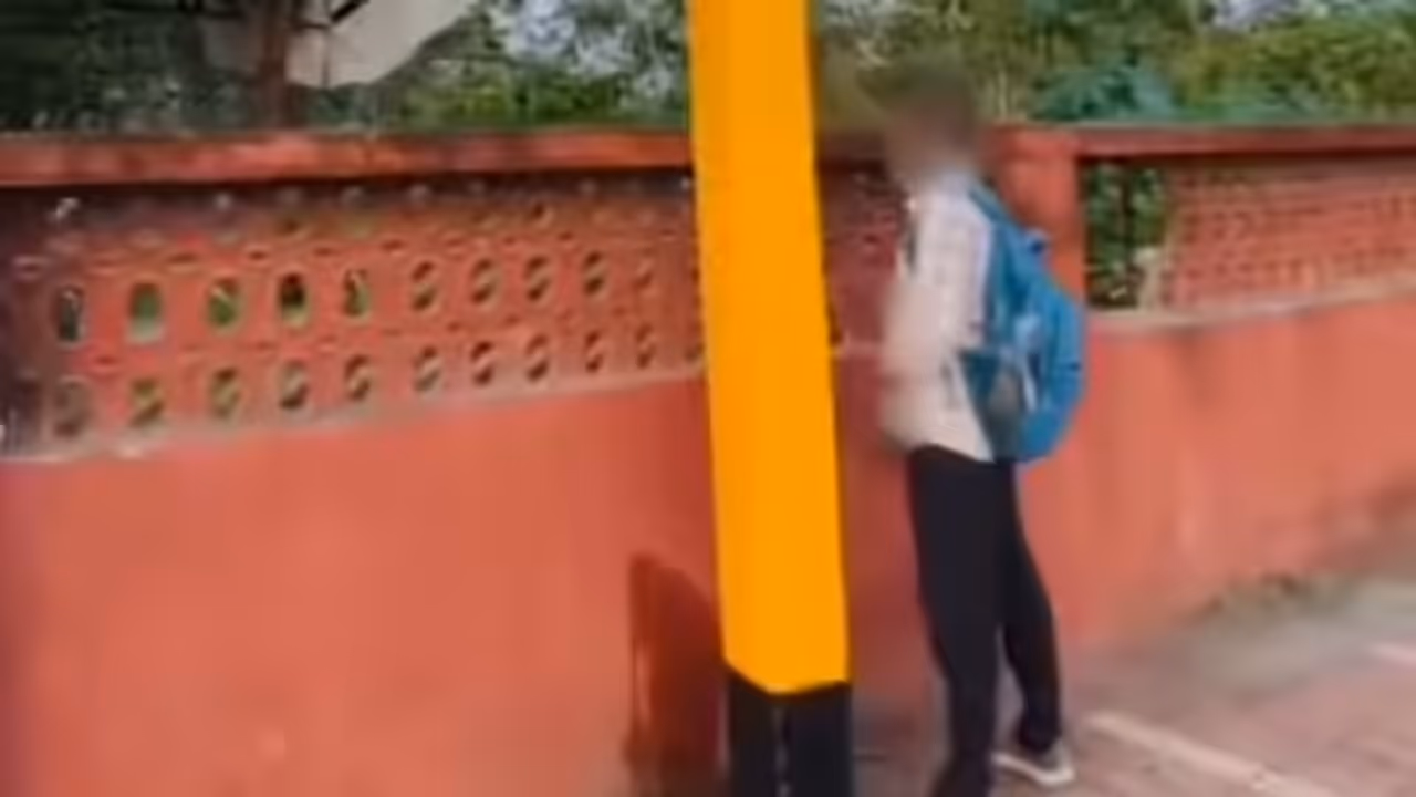 man urinating in railway station 