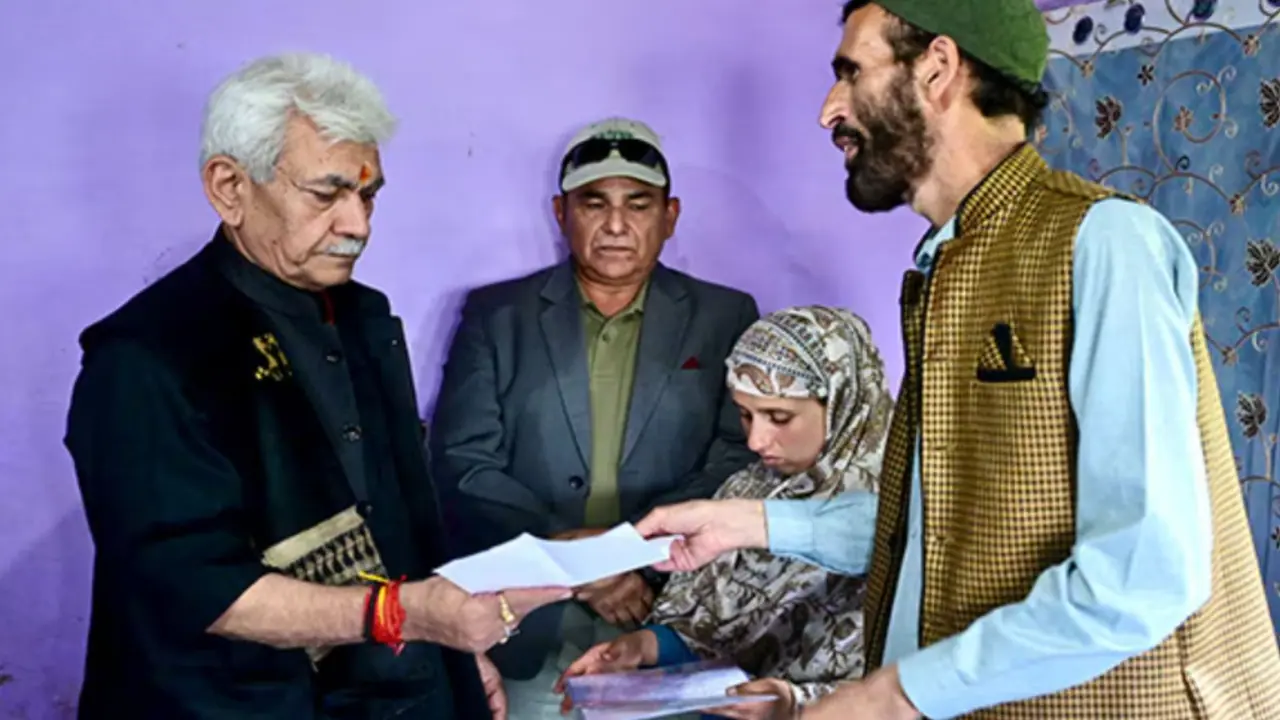 J&K LG Manoj Sinha hands job letter to his wife Gulnaz Akhter. (Photo/X/@OfficeOfLGJandK)