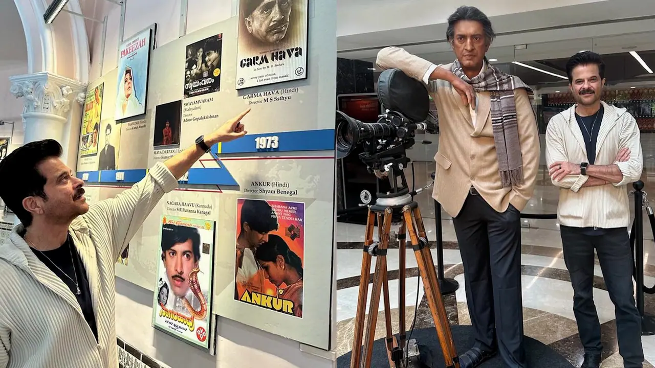 Anil Kapoor photographed standing next to Satyajit Rays statue at the Film Museum bsm