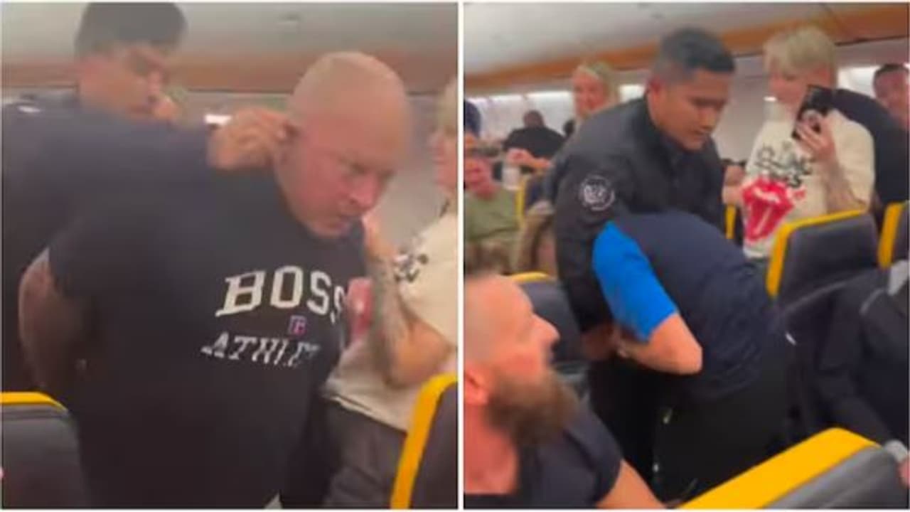 Drunk passenger tries to open plane's emergency exit, dragged off by ear