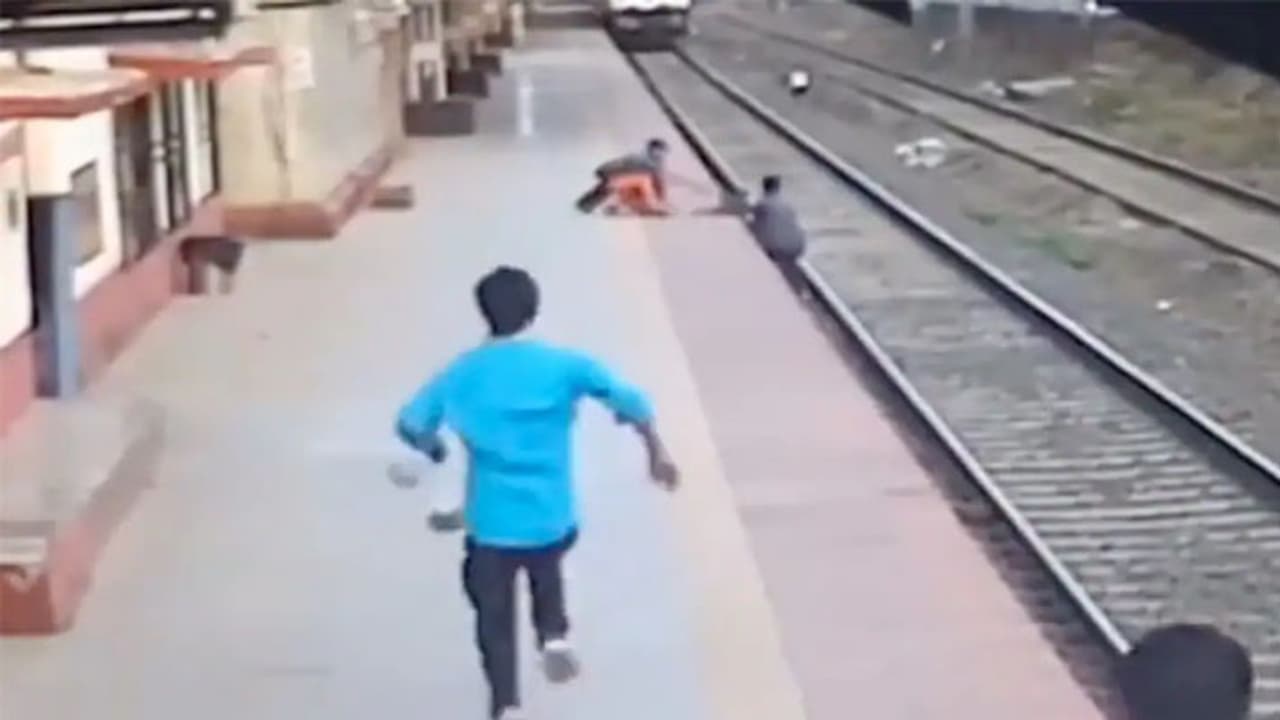 VVS Laxman shares viral Video of man saving visually impaired woman child from railway track VVS Laxman shares viral Video of man saving visually impaired woman child from railway track