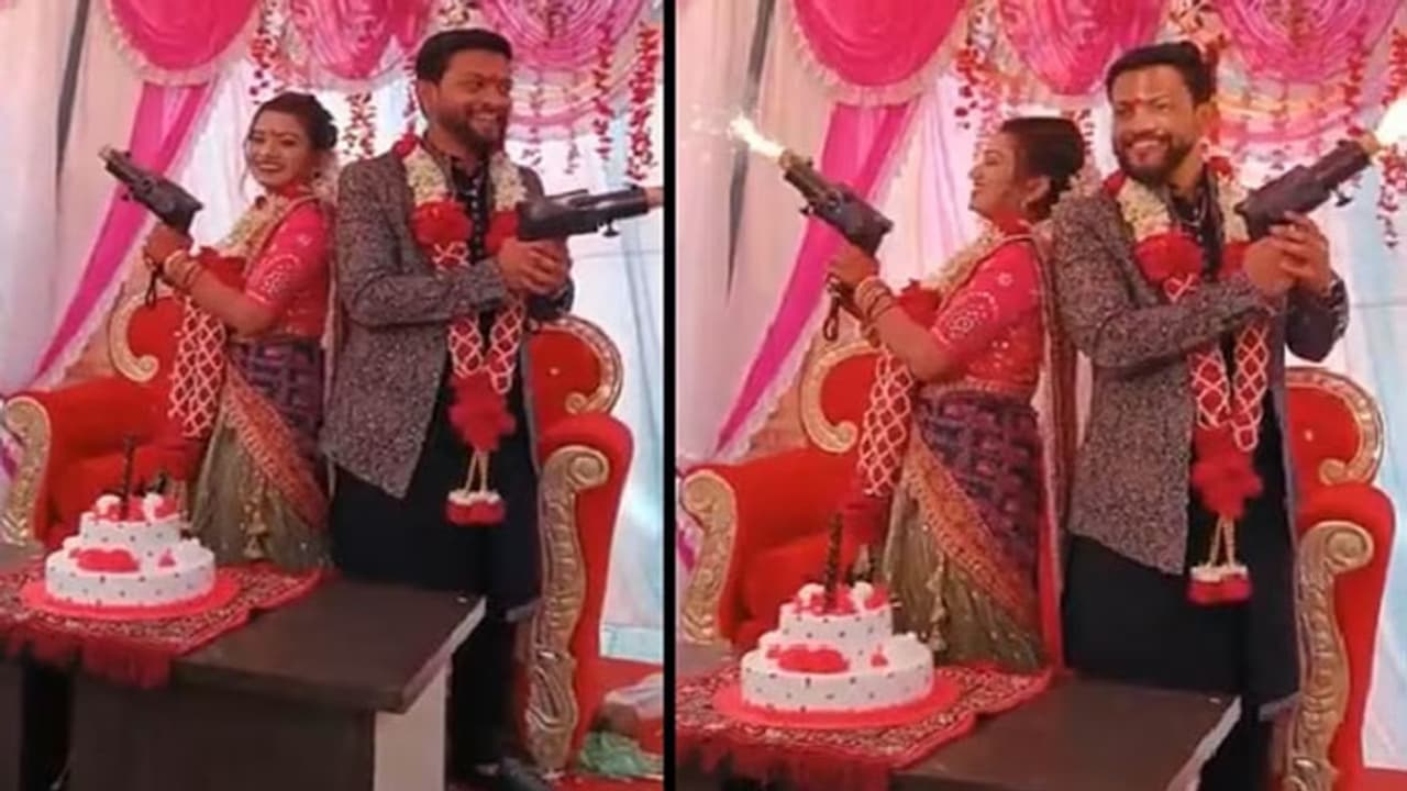 bride groom photographed with were posing with guns then fire on the face of the bride 