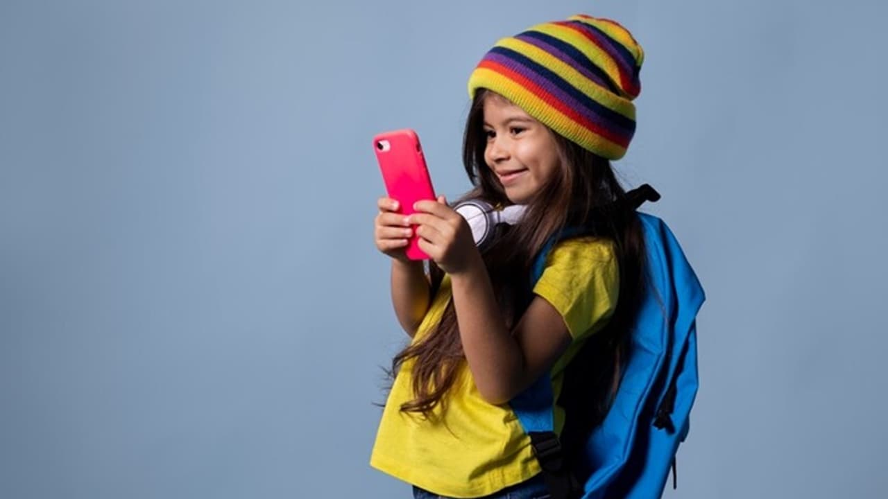 school girl checking her phone school girl checking her phone
