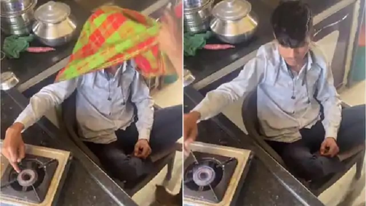 Boy igniting gas stove with a finger Boy igniting gas stove with a finger