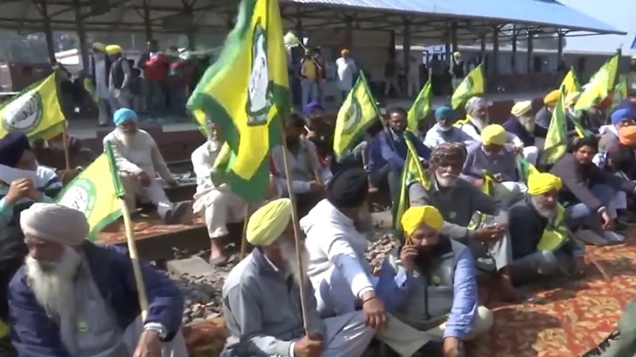 Protesters sitting on rail tracks Protesters sitting on rail tracks