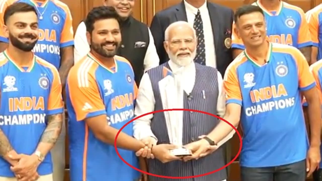 Narendra Modi hold Rohit Sharma hand Narendra Modi hold Rohit Sharma hand