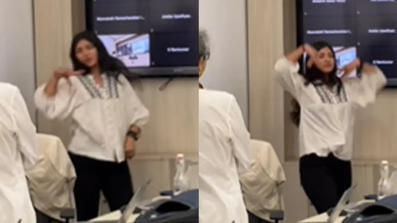 female employee dances female employee dances