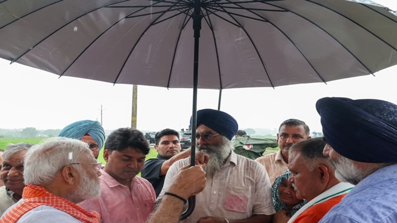 Narendra Modi with umbrella Narendra Modi with umbrella