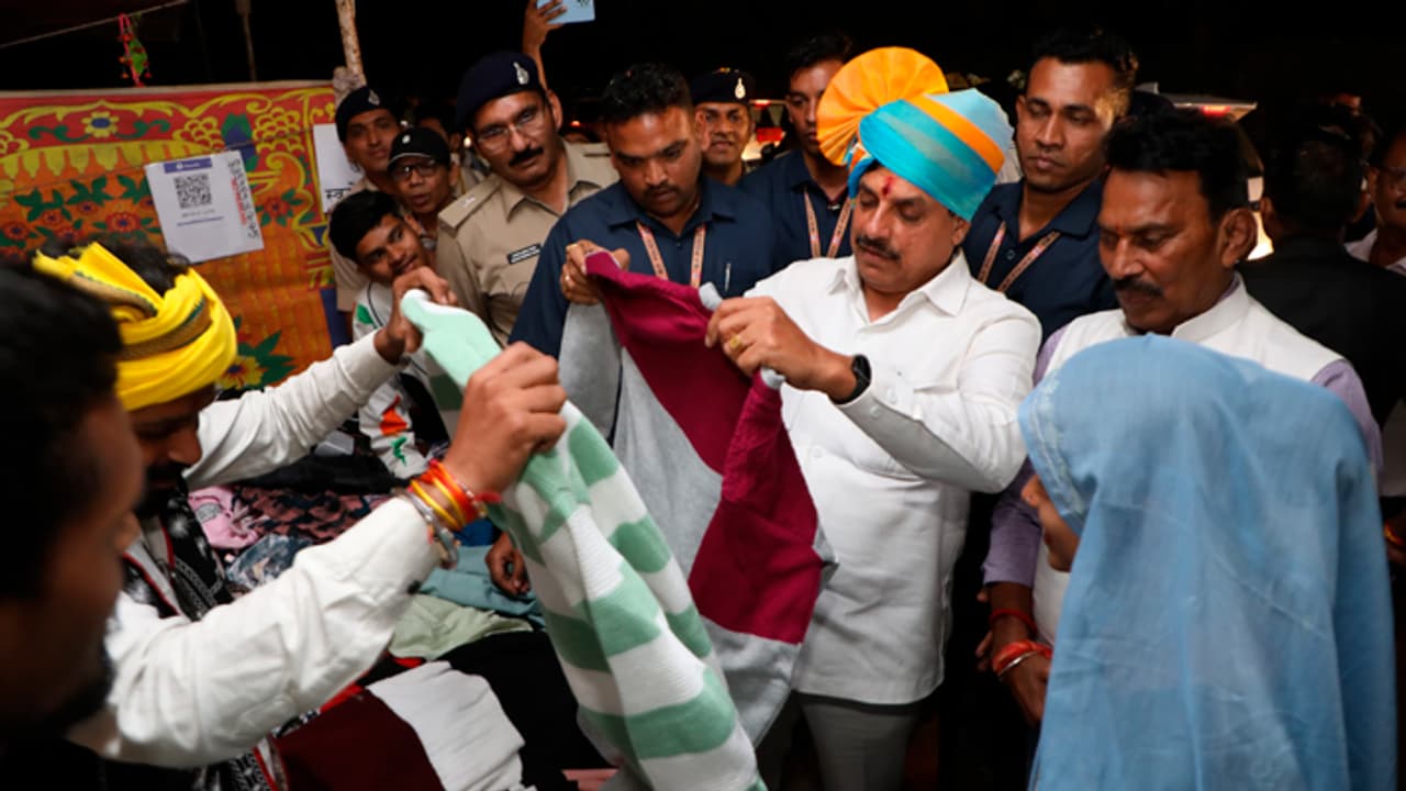 Mohan Yadav in Indore at bhilala samaj samagam bought sweater from a stall