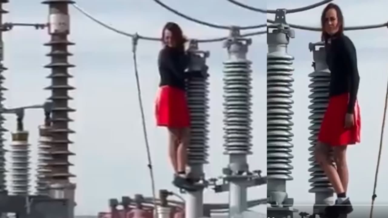 Woman climbs high voltage wires Woman climbs high voltage wires