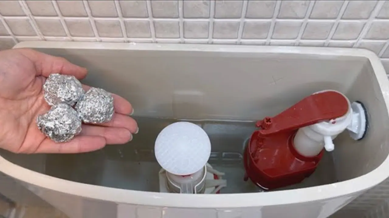 Aluminum foil in toilet flush tank Aluminum foil in toilet flush tank