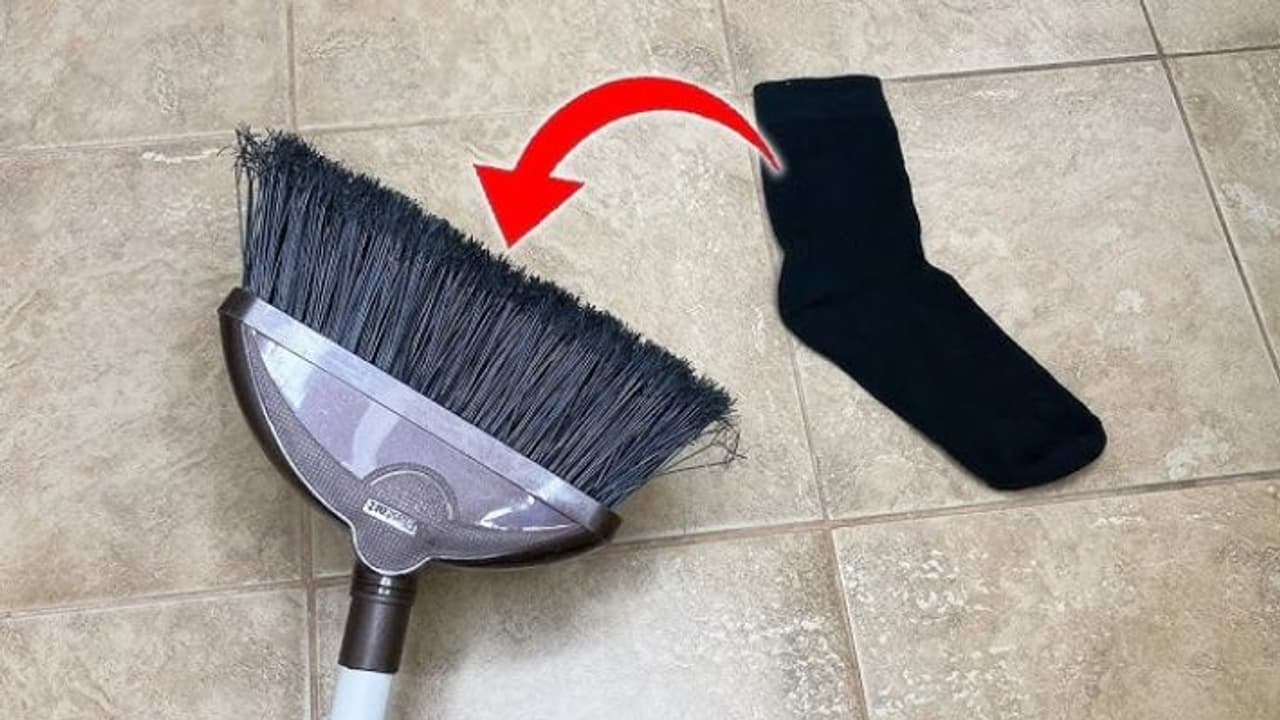 sock broom cleaning hack