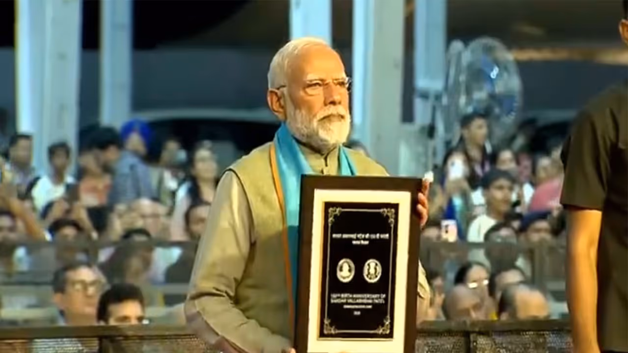 PM Modi Unveils Coin and Stamp for Sardar Patels 150th Birth Anniversary in Gujarat