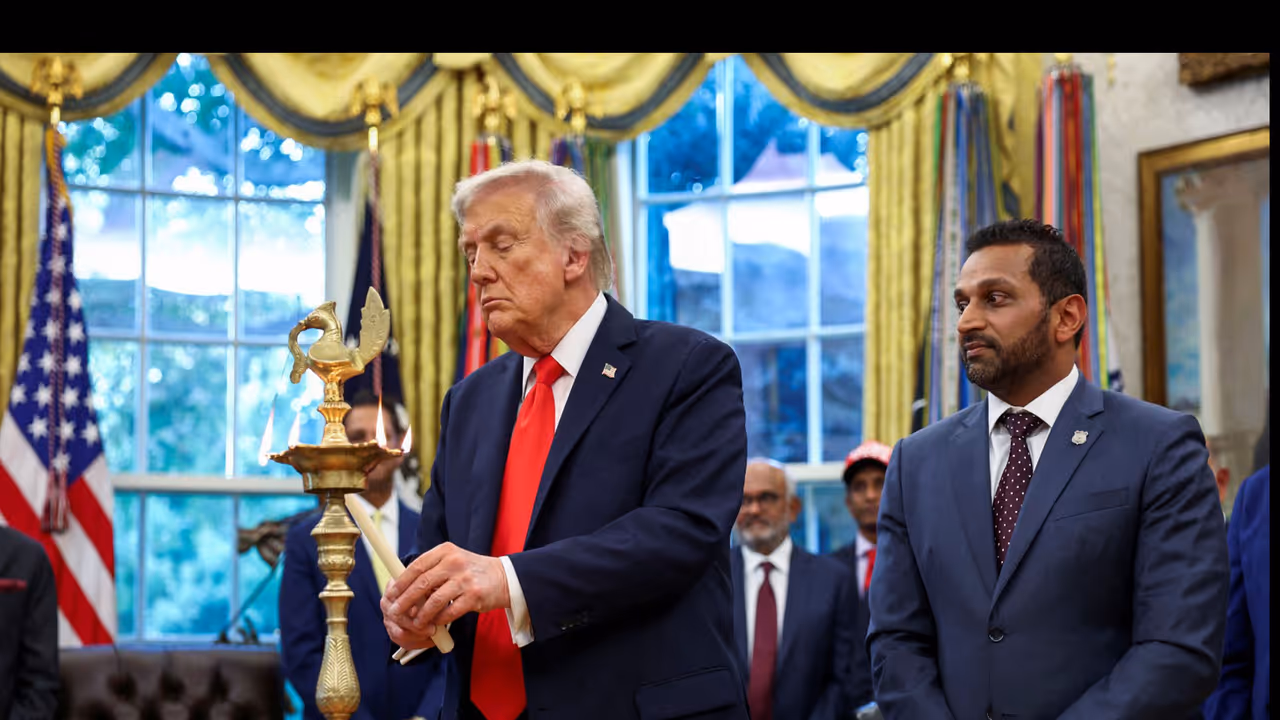 US President Donald Trump lights a candle as he participates in a Diwali celebration at the White House alongside FBI Director Kash Patel (Photo/Reuters) 