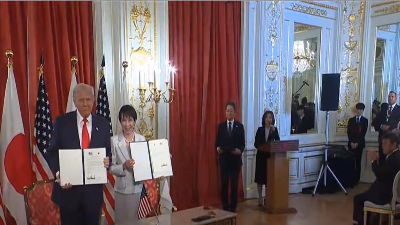 US President Donald Trump and Japanese Prime Minister Sanae Takaichi hold signed agreements during a ceremony in Tokyo. (Image: The White House/YouTube)
