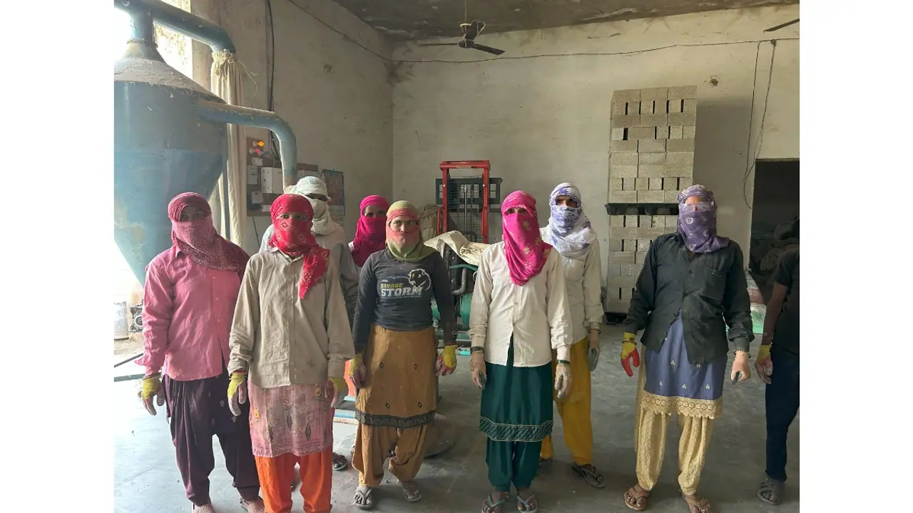 A group photo of women farmers trained by Gohemp, turning agricultural residue into eco friendly building bricks