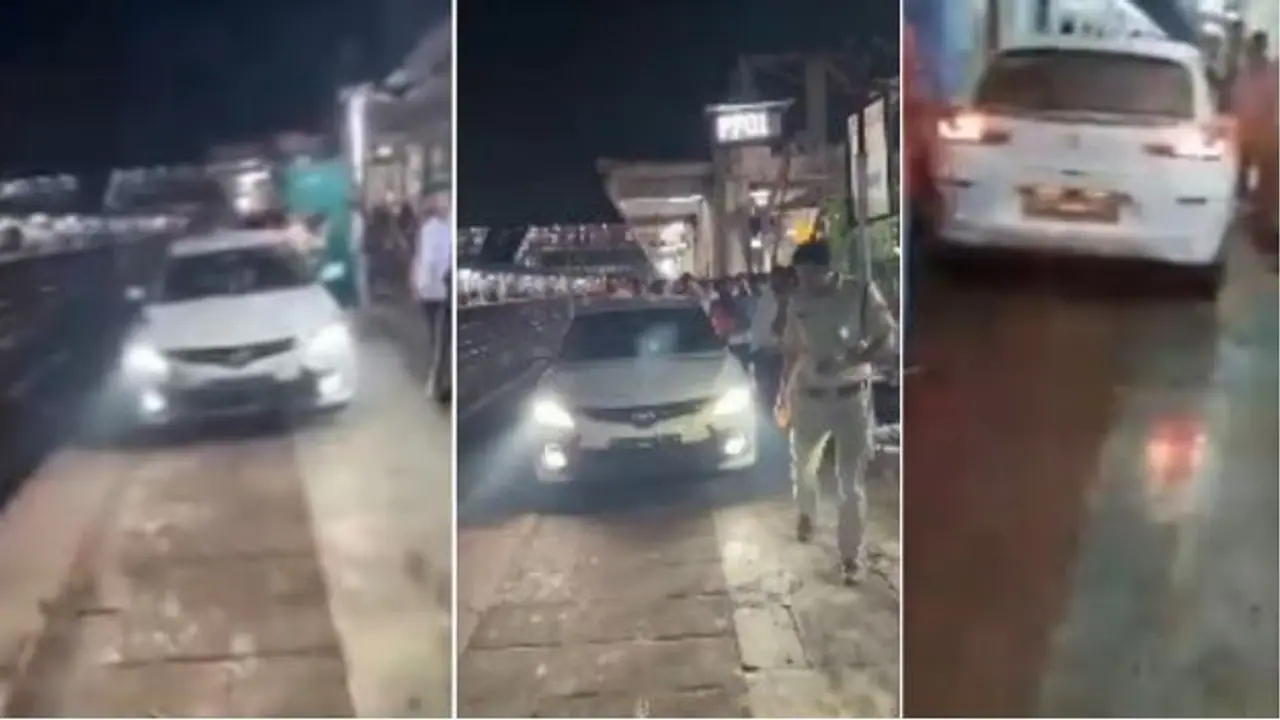 Man drives car on railway platform