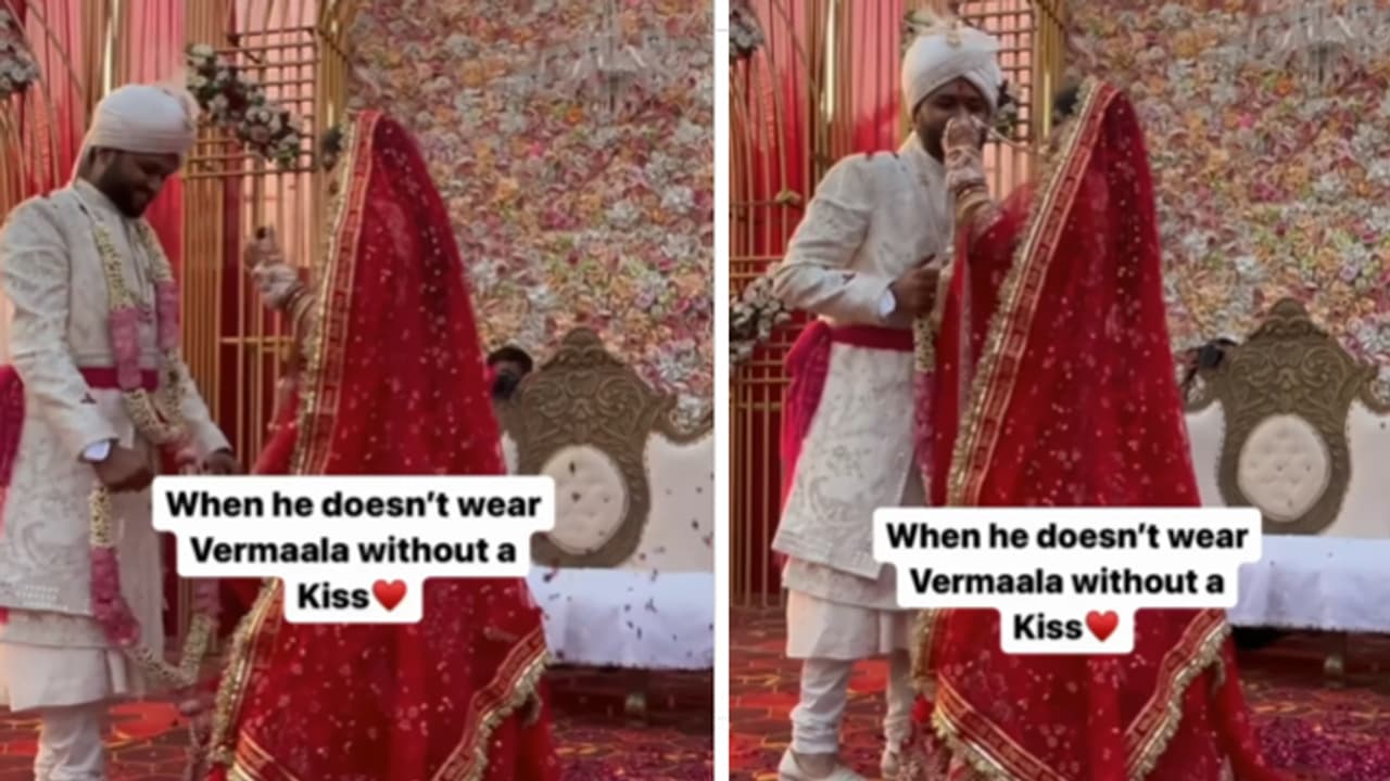 groom asking for a kiss during varmala groom asking for a kiss during varmala