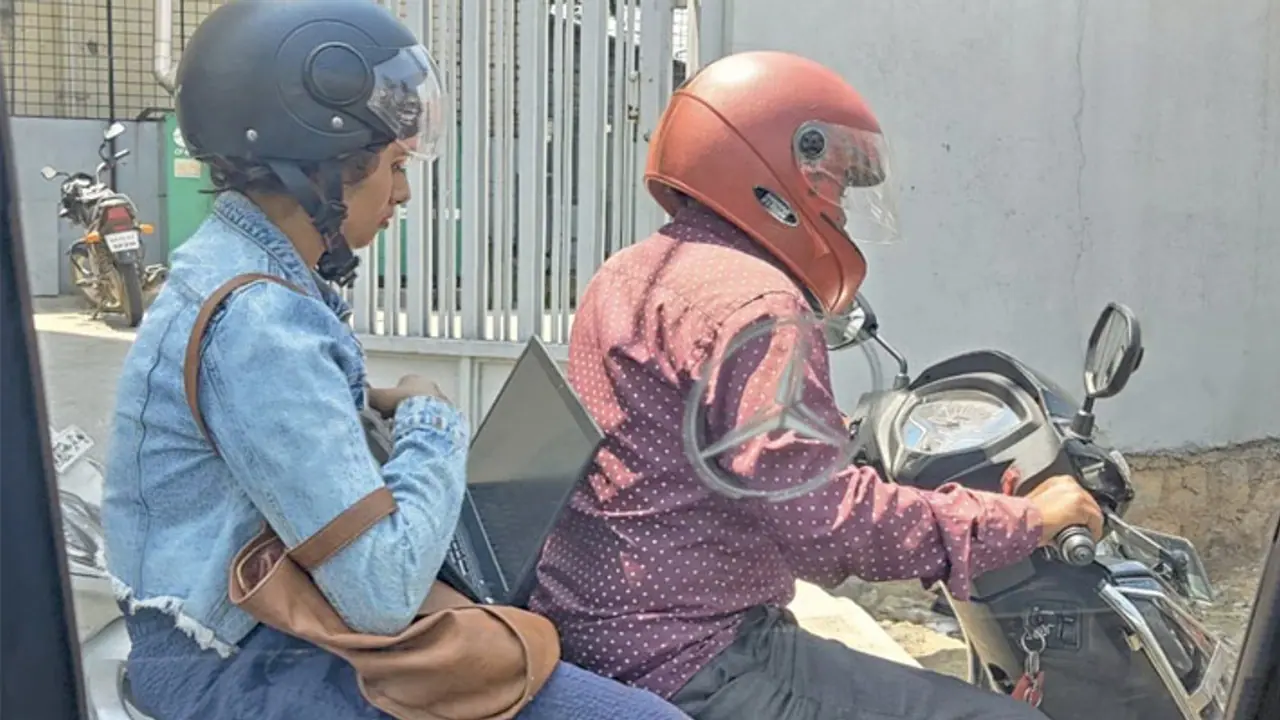 woman working on laptop stuck in traffic woman working on laptop stuck in traffic