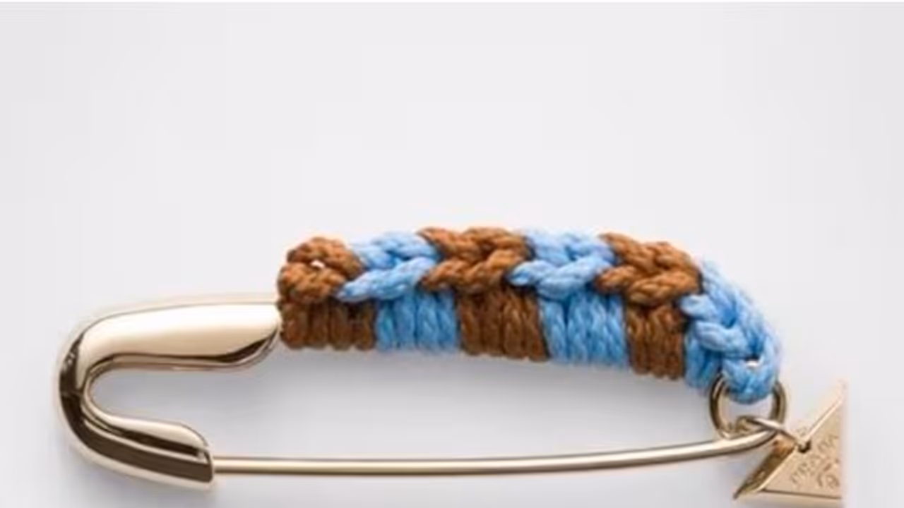 pradas another fraud sales safty pin worth 69000