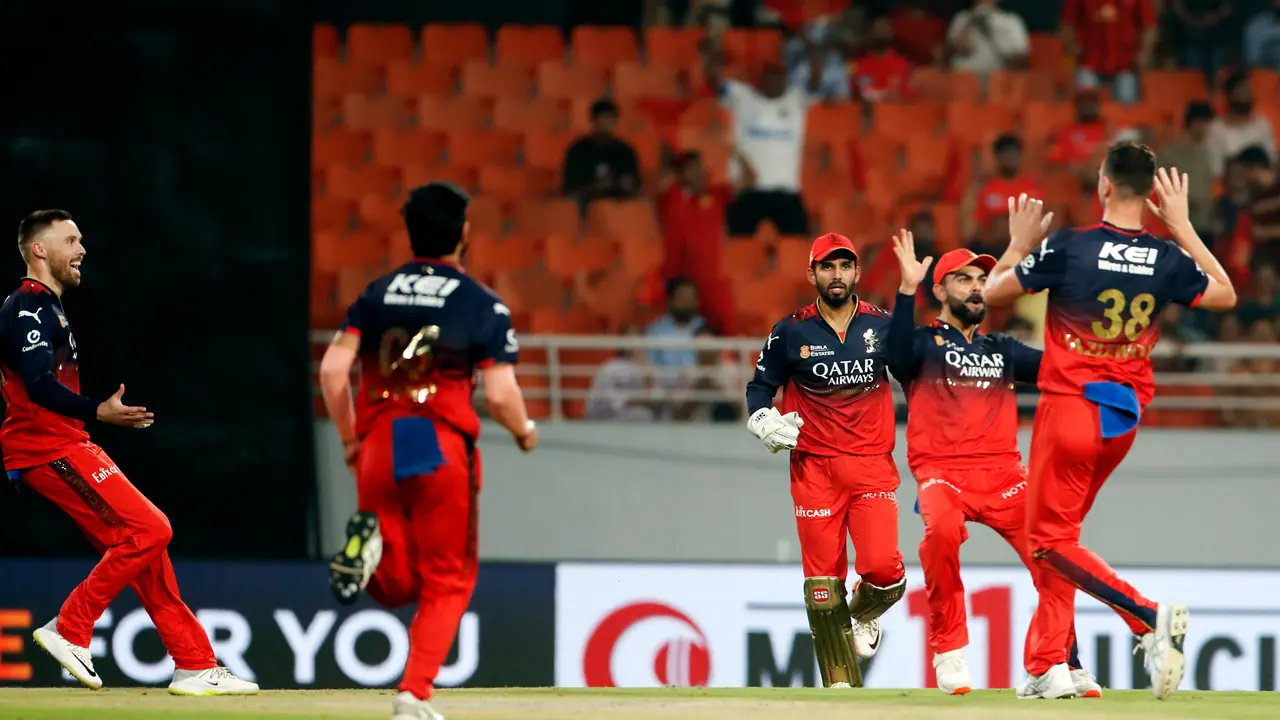 Royal Challengers Bengaluru's Virat Kohli and Josh Hazlewood celebrate the dismissal of Punjab Kings' Josh Inglis Royal Challengers Bengaluru's Virat Kohli and Josh Hazlewood celebrate the dismissal of Punjab Kings' Josh Inglis