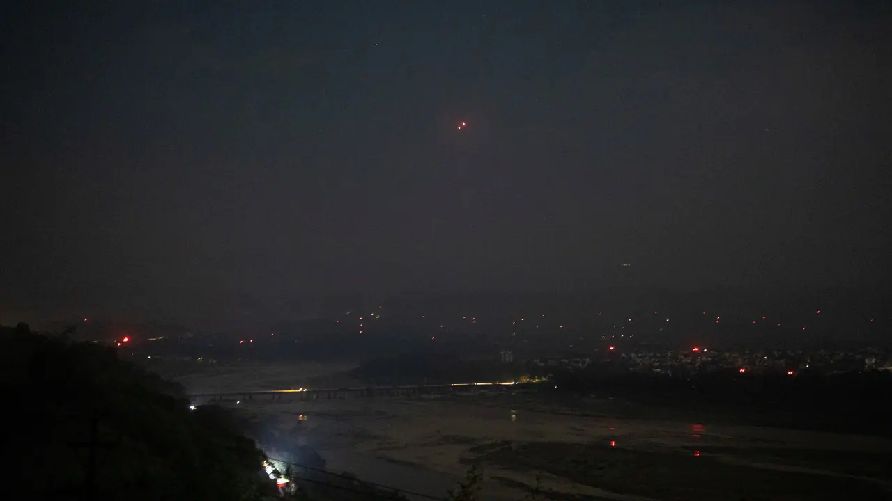 India's air defence system intercepts objects in the sky during a blackout following multiple blasts in the city of Jammu