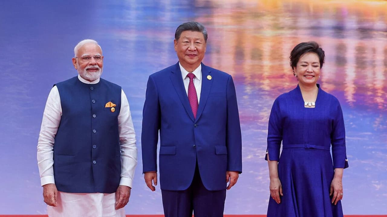 PM Modi, Chinese President Xi Jinping, and his wife Peng Liyuan arrive for the Official Reception for Heads of States and Heads of Governments at the SCO