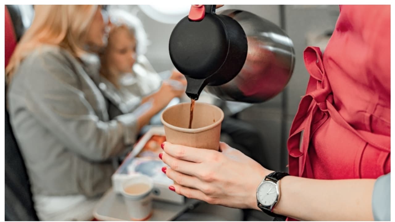 coffee serving during a flight trip coffee serving during a flight trip