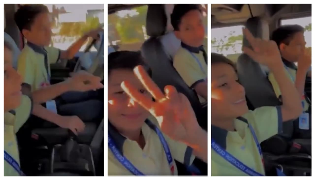 School students driving Thar through a busy road in Rajasthan