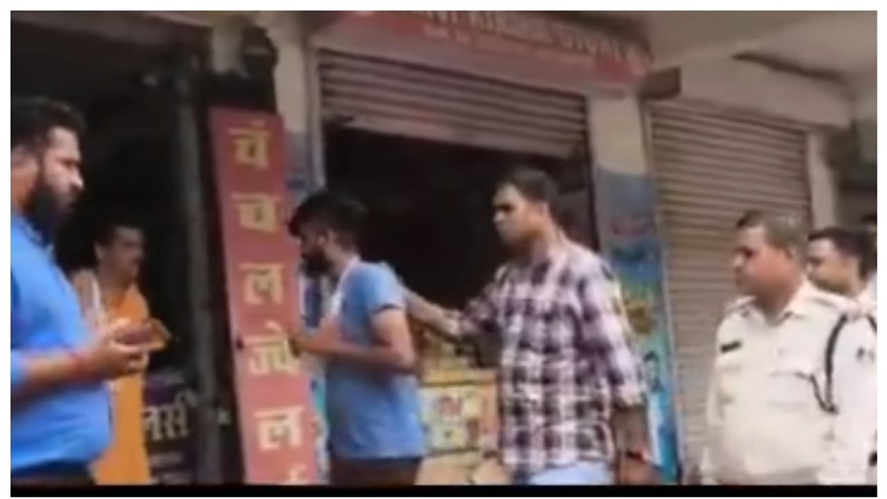 police led the criminal along the street and made him apologize police led the criminal along the street and made him apologize