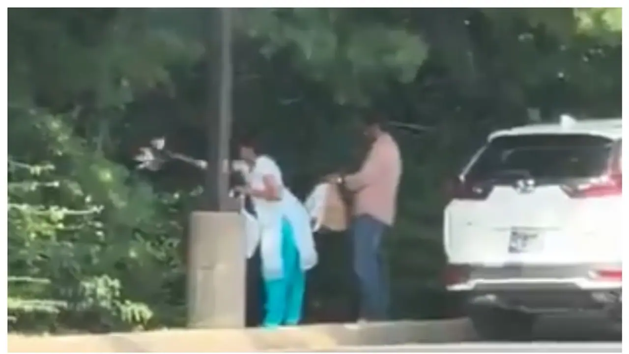 indian couple throwing garbage in a public place in Canada indian couple throwing garbage in a public place in Canada
