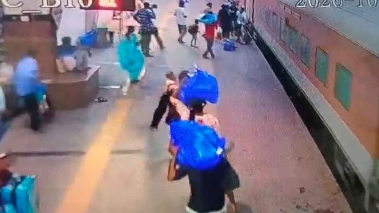 Caught On Cam: Hyderabad Man Nearly Falls Under Moving Train While Holding Daughter, RPF Cop Saves Them Caught On Cam: Hyderabad Man Nearly Falls Under Moving Train While Holding Daughter, RPF Cop Saves Them