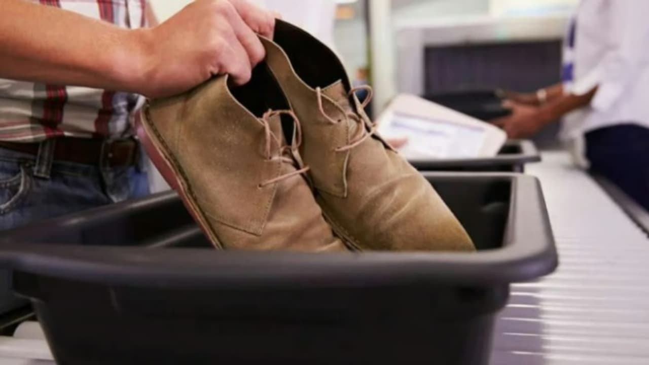 Removing shoes in airport Removing shoes in airport