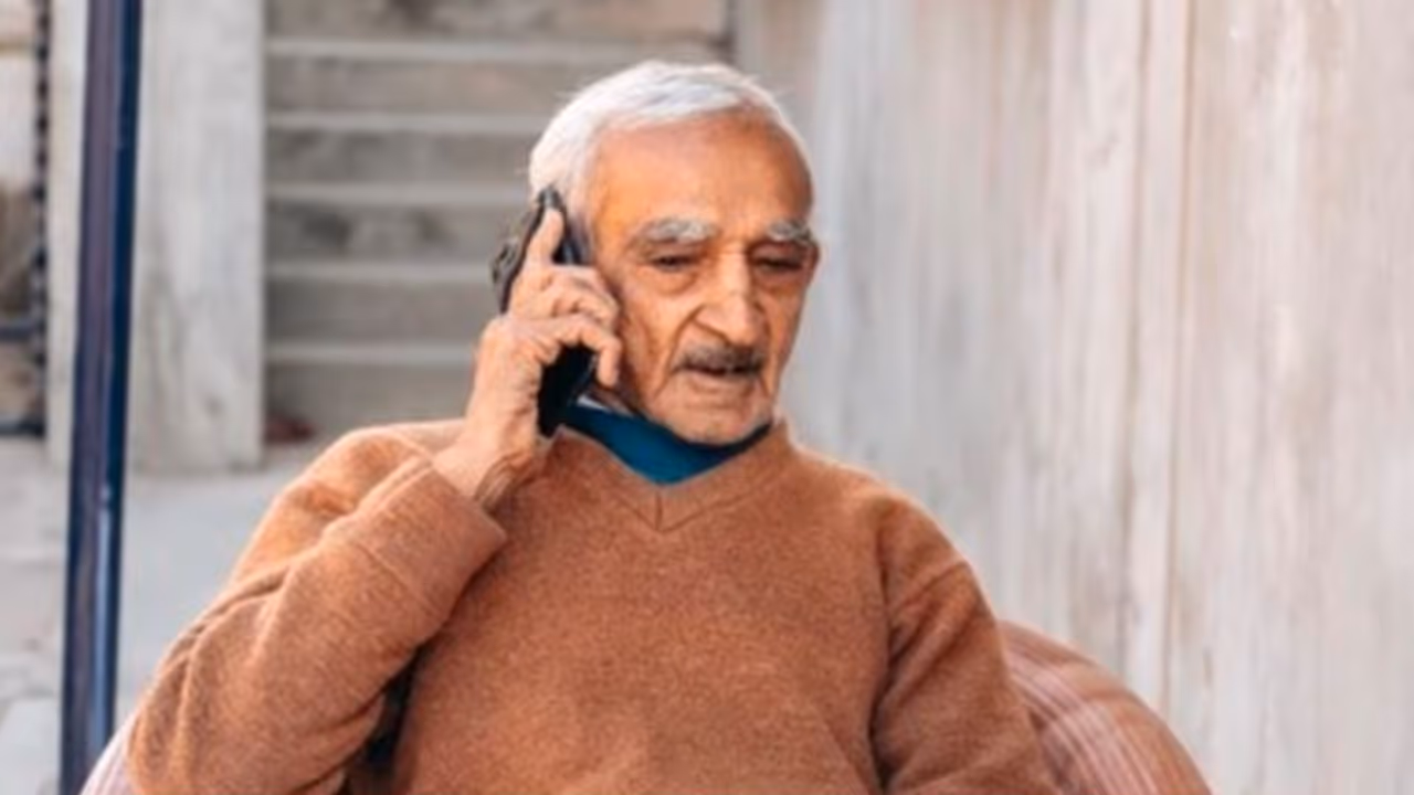 old man talking in phone