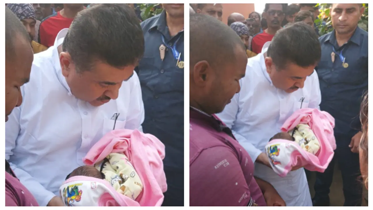 BJP leader Suvendu Adhikari holds the newborn child of the victim of the saline incident bsm BJP leader Suvendu Adhikari holds the newborn child of the victim of the saline incident bsm