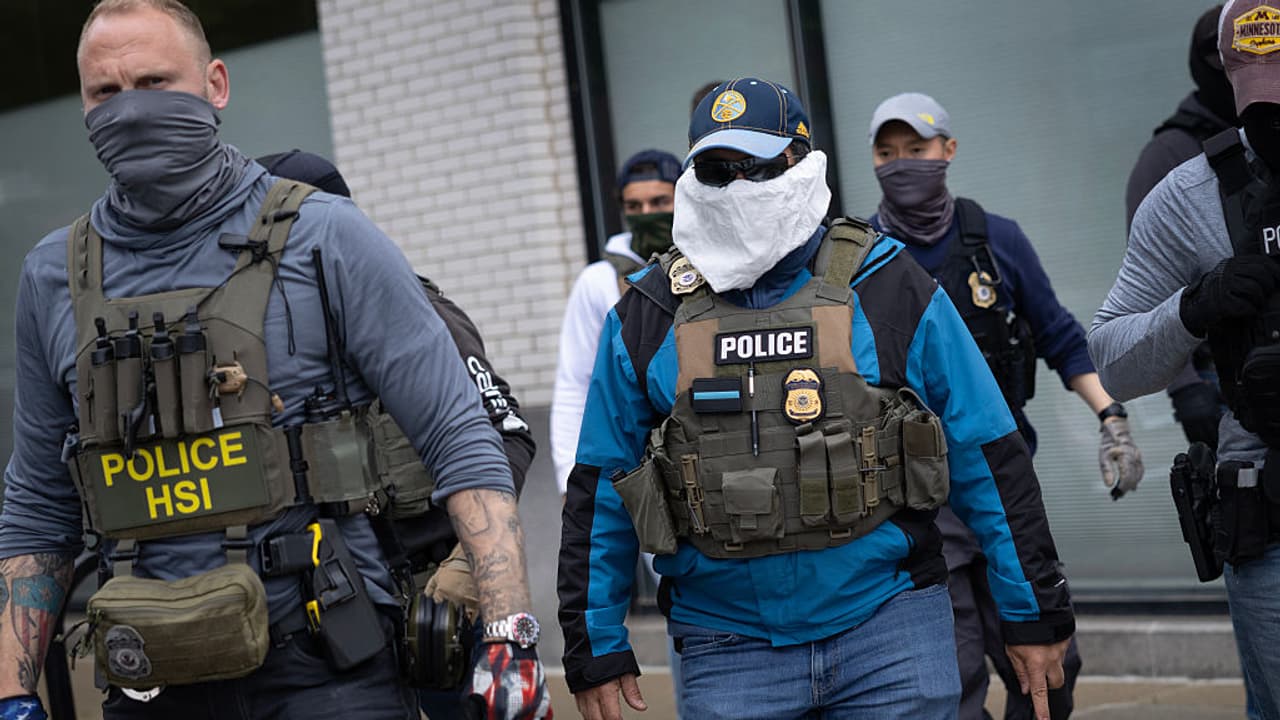 ICE officials in mask