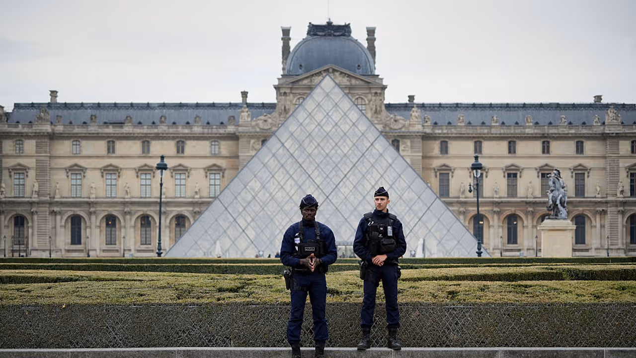 Police stand guard outside the Louvre museum at Louvre in Paris, France. Police stand guard outside the Louvre museum at Louvre in Paris, France.