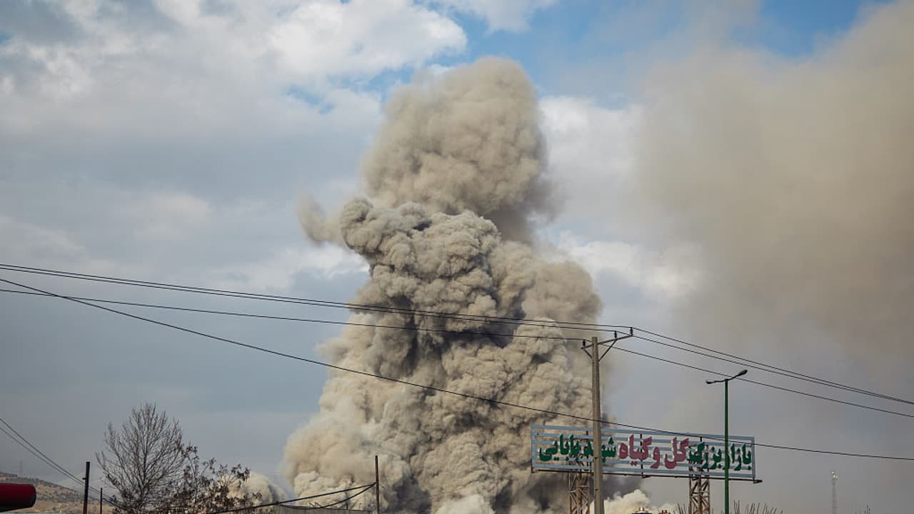 A plume of smoke rises after an explosion in Iran's Tehran A plume of smoke rises after an explosion in Iran's Tehran