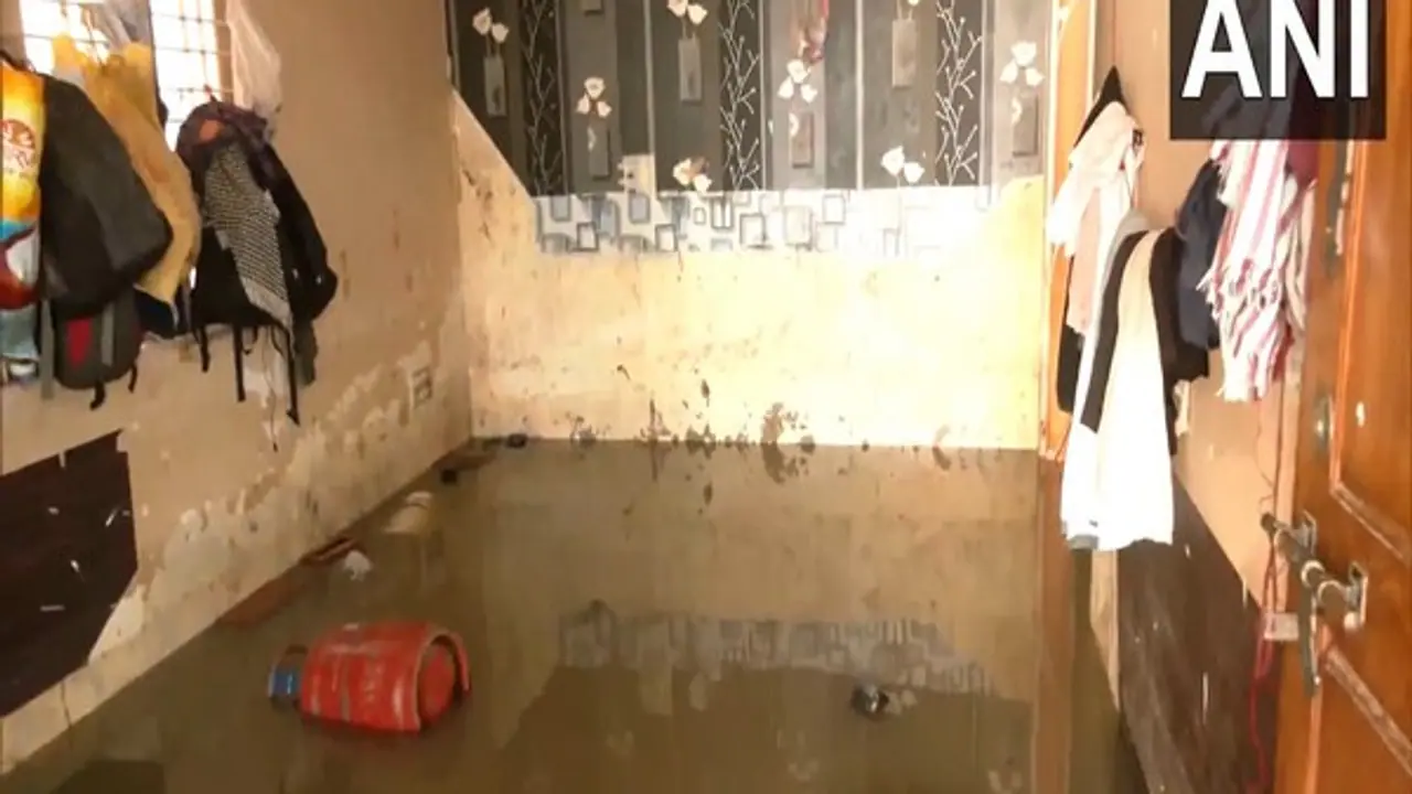 Heavy rainfall lashed several parts of Bengaluru, causing severe waterlogging and flooding in residential areas. (Photo/ANI)