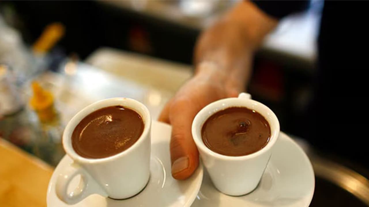 A waiter carries two cups of Turkish coffee at a coffee shop in Istanbul (Image/Reuters) A waiter carries two cups of Turkish coffee at a coffee shop in Istanbul (Image/Reuters)